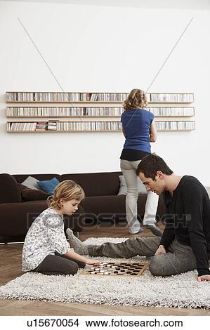 Father and daughter playing checkers View Large Photo Image Picture - Father and daughter playing checkers. Fotosearch