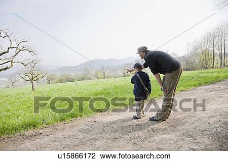 Stock Image - Father and son enjoying an afternoon. Fotosearch