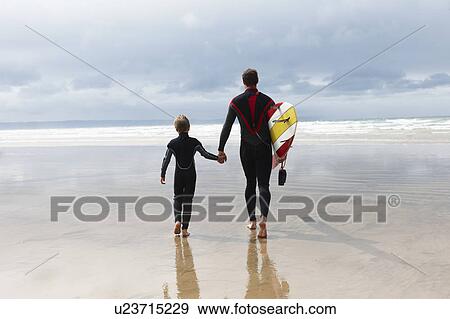 Stock Photo - Father and Son going surfing. Fotosearch