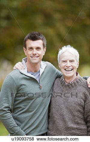 Father and son in the park View Large Photo Image Stock Photo - Father and son in the park. Fotosearch