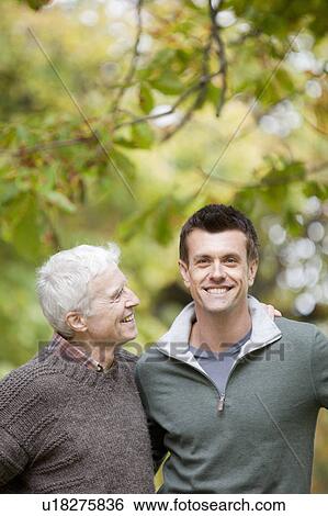 Father and son in the park View Large Photo Image Stock Photograph - Father and son in the park. Fotosearch