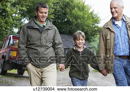 Picture - Father son and grandfather walking. Fotosearch