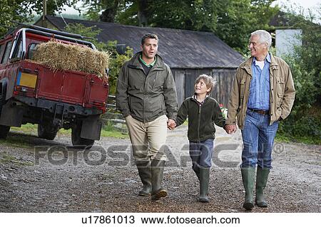 Stock Image - Father son and grandfather walking. Fotosearch
