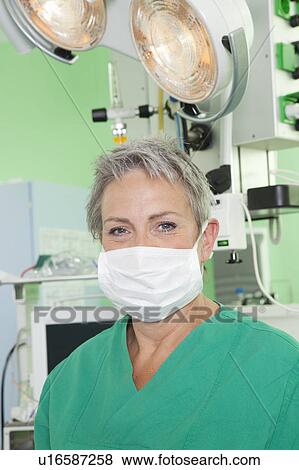 Female doctor with scrub and op mask View Large Photo Image Stock Photo - Female doctor with scrub and op mask. Fotosearch