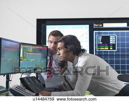 Financial traders with screens View Large Photo Image Stock Photo - Financial traders with screens. Fotosearch