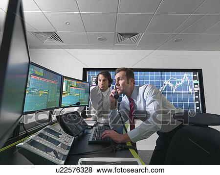 Stock Photo - Financial traders with screens. Fotosearch