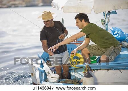 Fisher at work View Large Photo Image Stock Photo - Fisher at work. Fotosearch
