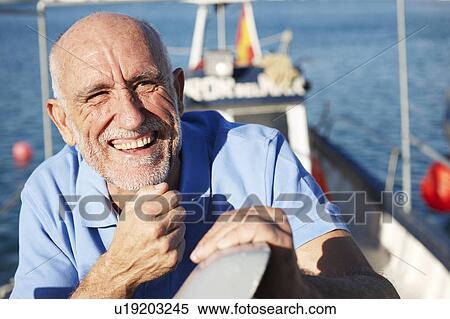 Fisherman on fishing boat View Large Photo Image Stock Photography - Fisherman on fishing boat. Fotosearch