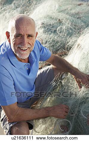 Stock Image - Fisherman with nets. Fotosearch
