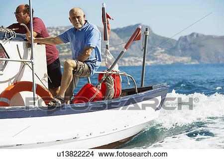 Picture - Fishermen on fishing boats. Fotosearch