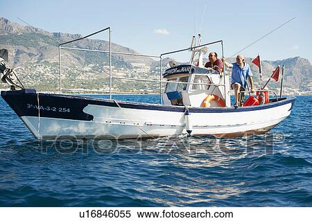Stock Photography - Fishermen on fishing boats. Fotosearch