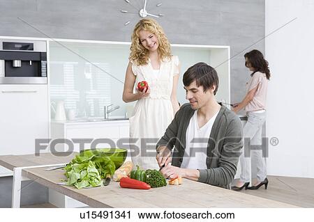 Friends cooking View Large Photo Image Stock Image - Friends cooking. Fotosearch