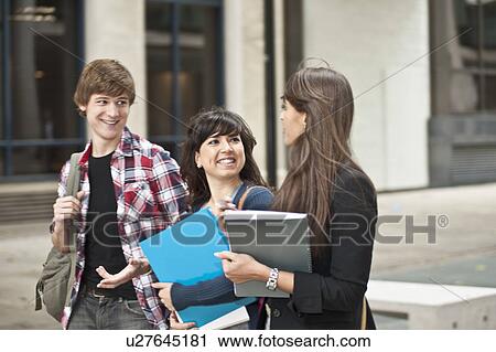 Friends walking in street View Large Photo Image Stock Image - Friends walking in street. Fotosearch