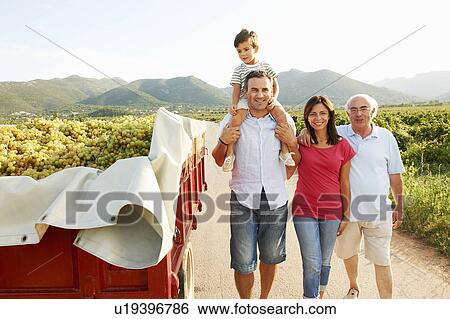 Generational family walking in vineyard View Large Photo Image Stock Photograph - Generational family walking in vineyard. Fotosearch