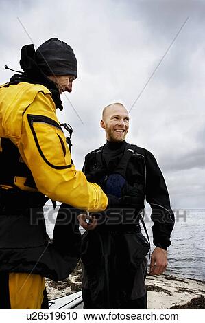Stock Image - Getting redy for Kayak. Fotosearch