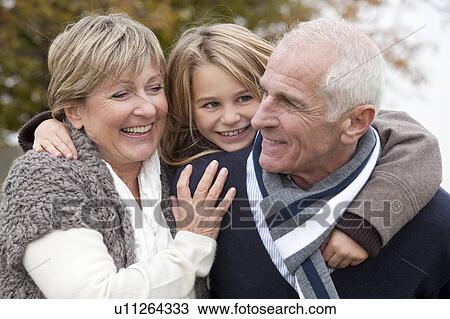 Girl and grandparents in autumn View Large Photo Image Stock Image - Girl and grandparents in autumn. Fotosearch