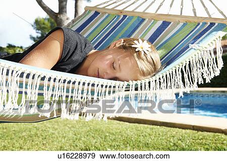 Girl asleep in hammock View Large Photo Image Stock Photo - Girl asleep in hammock. Fotosearch