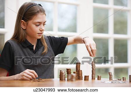 Girl counting piles of money View Large Photo Image Stock Image - Girl counting piles of money. Fotosearch