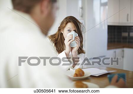 Girl drinking coffee in kitchen View Large Photo Image Stock Image - Girl drinking coffee in kitchen. Fotosearch