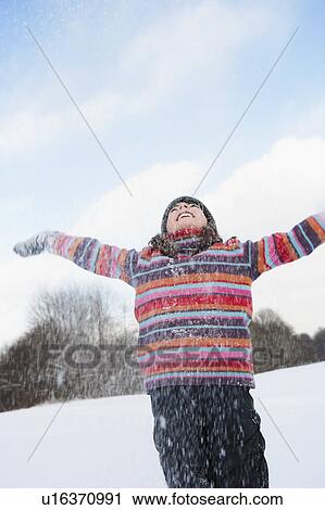 Girl embracing sky View Large Photo Image Stock Image - Girl embracing sky. Fotosearch