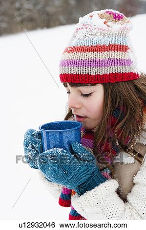 Stock Photograph - Girl having hot drink. Fotosearch