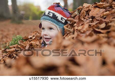 Girl in autumn leaves View Large Photo Image Stock Image - Girl in autumn leaves. Fotosearch