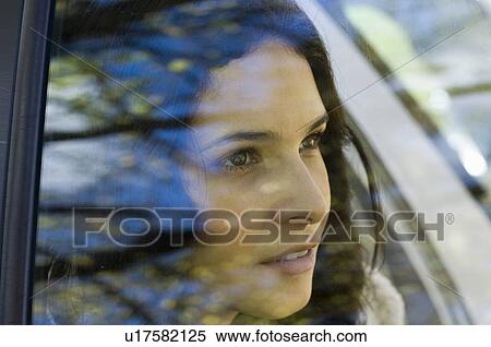Stock Photography - Girl in car behind windscreen. Fotosearch