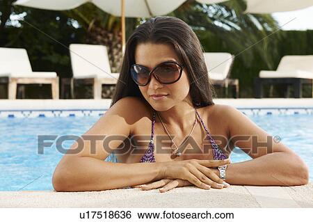 Girl in hotel swimming pool View Large Photo Image Stock Photograph - Girl in hotel swimming pool. Fotosearch