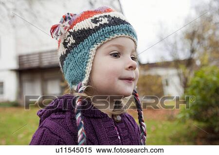 Girl in knitted cap View Large Photo Image Stock Photography - Girl in knitted cap. Fotosearch