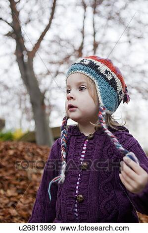 Girl in purple knitted sweater View Large Photo Image Stock Photo - Girl in purple knitted sweater. Fotosearch