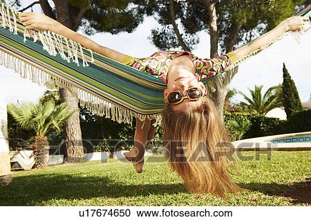 Girl lying in hammock View Large Photo Image Stock Image - Girl lying in hammock. Fotosearch