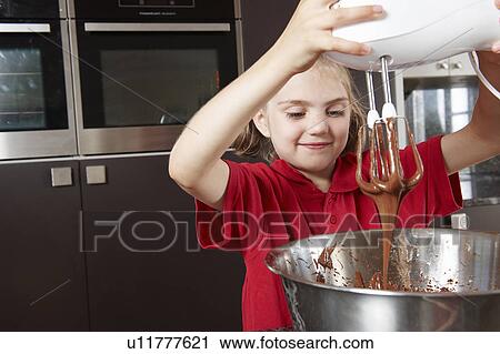 Girl making cake with mixing bowl View Large Photo Image Stock Image - Girl making cake with mixing bowl. Fotosearch