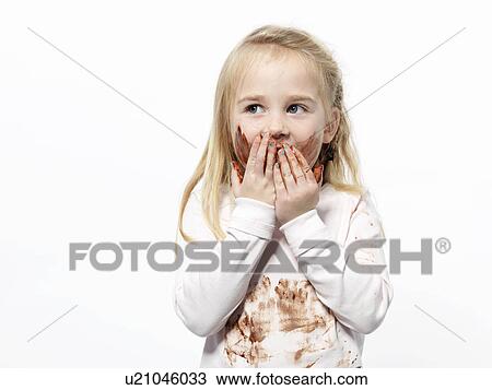 Girl playing with chocolate sauce View Large Photo Image Stock Image - Girl playing with chocolate sauce. Fotosearch