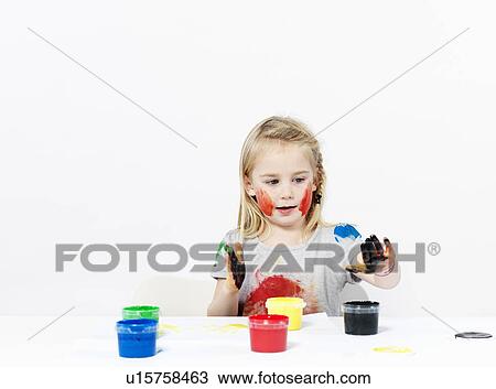 Girl playing with finger paint View Large Photo Image Stock Image - Girl playing with finger paint. Fotosearch