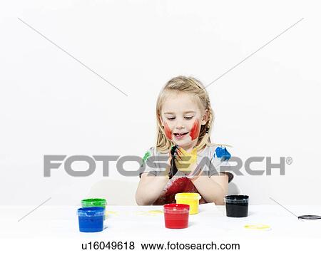 Girl playing with finger paint View Large Photo Image Stock Photo - Girl playing with finger paint. Fotosearch