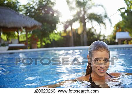 Girl relaxing in swimming pool View Large Photo Image Stock Image - Girl relaxing in swimming pool. Fotosearch