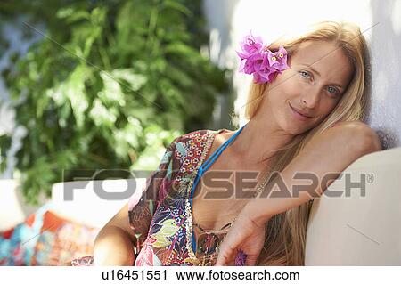 Girl relaxing in the sun on sun bed View Large Photo Image Stock Image - Girl relaxing in the sun on sun bed. Fotosearch