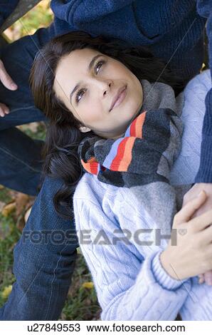 Stock Image - Girl resting head on man's lap. Fotosearch