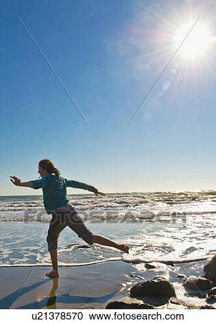 Girl runs on beach View Large Photo Image Stock Image - Girl runs on beach. Fotosearch