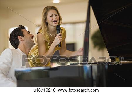 Girl singing View Large Photo Image Stock Photograph - Girl singing. Fotosearch
