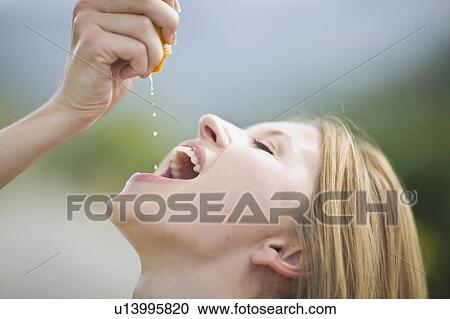 Girl squashing orange View Large Photo Image Stock Image - Girl squashing orange. Fotosearch