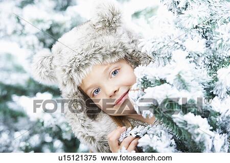 Girl standing between snowy trees View Large Photo Image Stock Photography - Girl standing between snowy trees. Fotosearch
