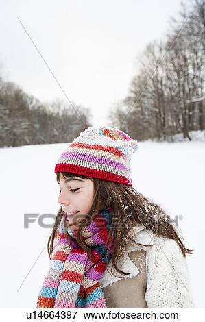 Girl standing in snowfield View Large Photo Image Stock Photo - Girl standing in snowfield. Fotosearch