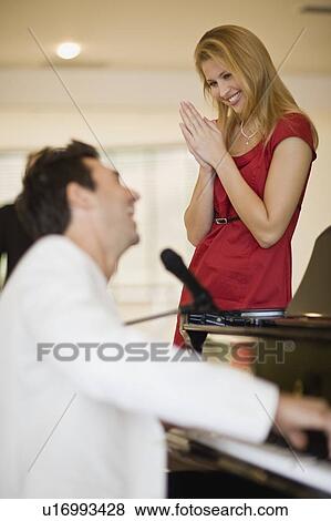Girl watching the piano player View Large Photo Image Stock Photo - Girl watching the piano player. Fotosearch