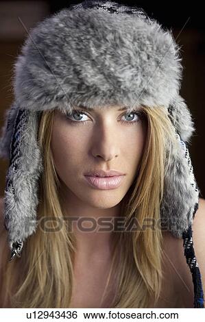 Stock Photograph - Girl wearing hat. Fotosearch