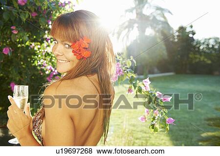Girl with champagne relaxing in the sun View Large Photo Image Stock Photo - Girl with champagne relaxing in the sun. Fotosearch
