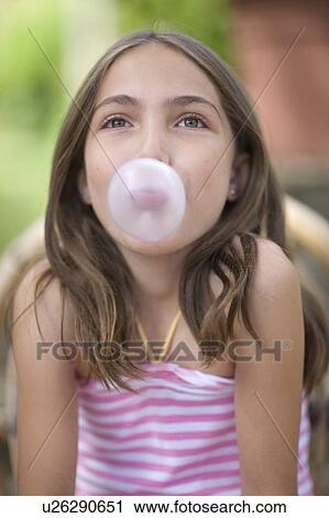 Stock Image - Girl with chewing gum. Fotosearch