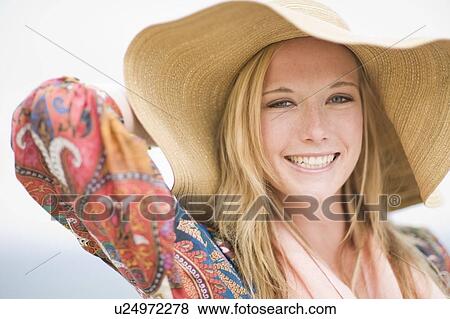 Stock Photo - Girl with floppy hat. Fotosearch