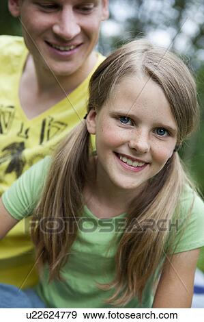 Girl with her older brother View Large Photo Image Stock Photo - Girl with her older brother. Fotosearch