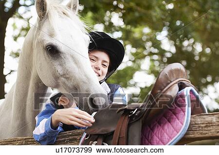 Girl with her pony View Large Photo Image Stock Photo - Girl with her pony. Fotosearch